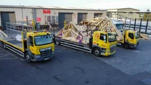 Loading bay area with trucks and racks of materials