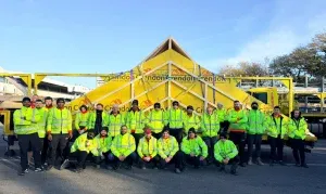 Crendon team posing in front of a loaded lorry