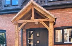 Timber porch on a building with black windows