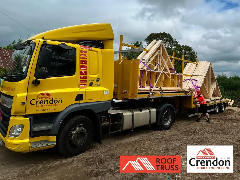Timber roof trusses on yellow lorry