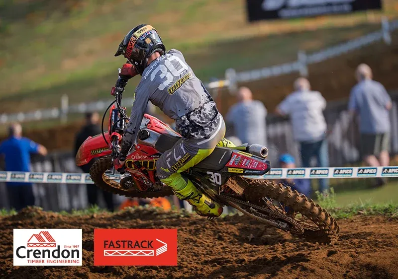 Rider cornering with front wheel in the air