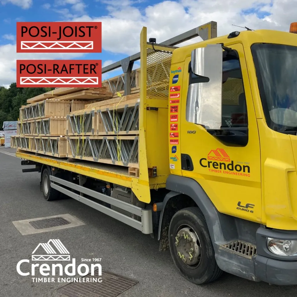 Yellow lorry loaded with Posi-Joist and Posi-Rafters