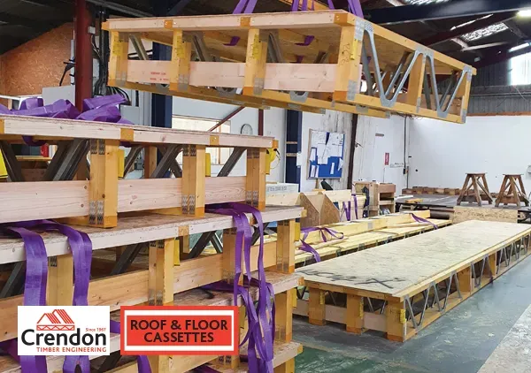 Stack of Roof and Floor Cassettes with one lifted in the air by a crane
