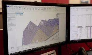 Computer screen showing three dimensional building plans