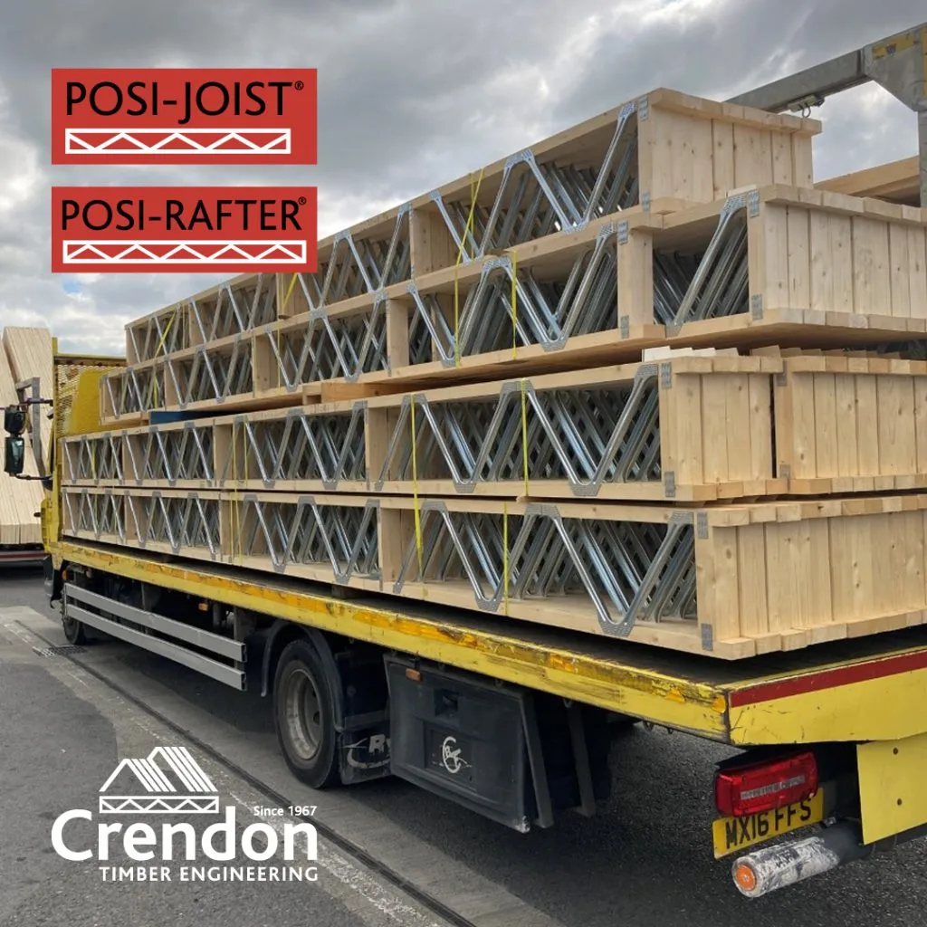Yellow lorry loaded with Posi-Joist and Posi-Rafters