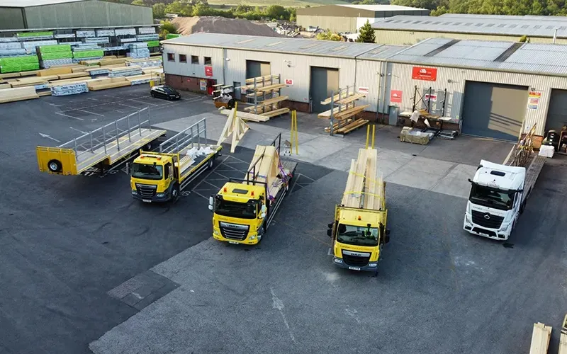 Crendon yard/loading bay with lorries loaded with products and racks of materials
