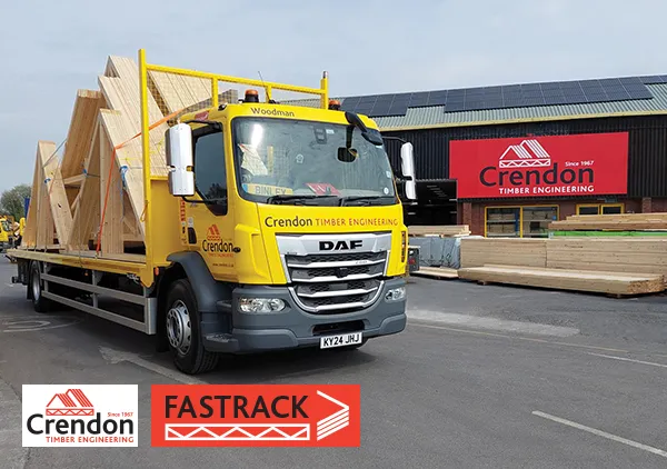 Loaded yellow lorry in front of a Crendon warehouse