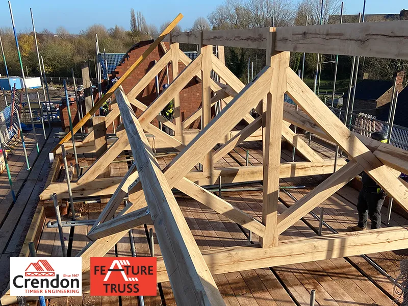 Feature Trusses creating the frame of a roof on a building under construction