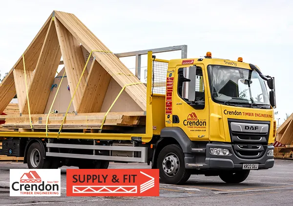 Yellow lorry loaded with Roof Trusses